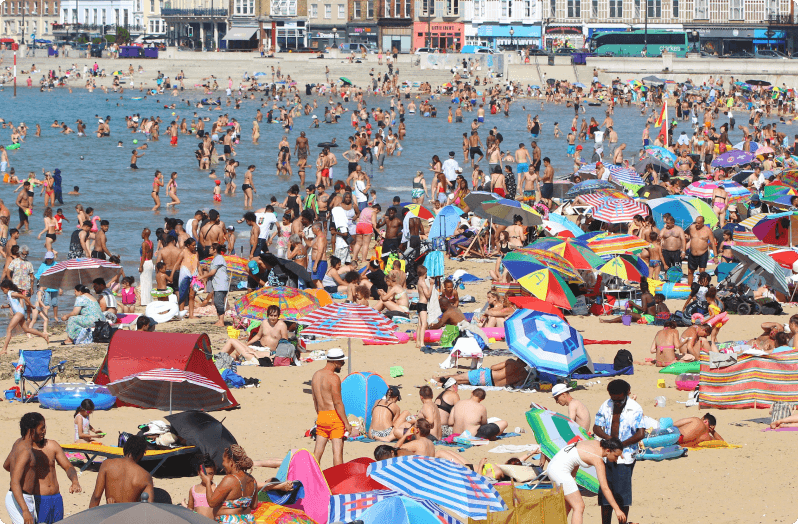 crowded beach in UK on a hot day