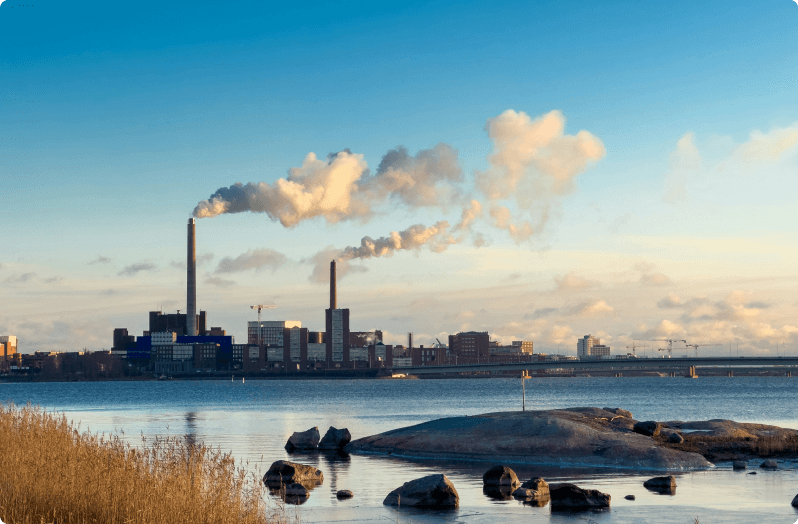 factory pictured near body of water